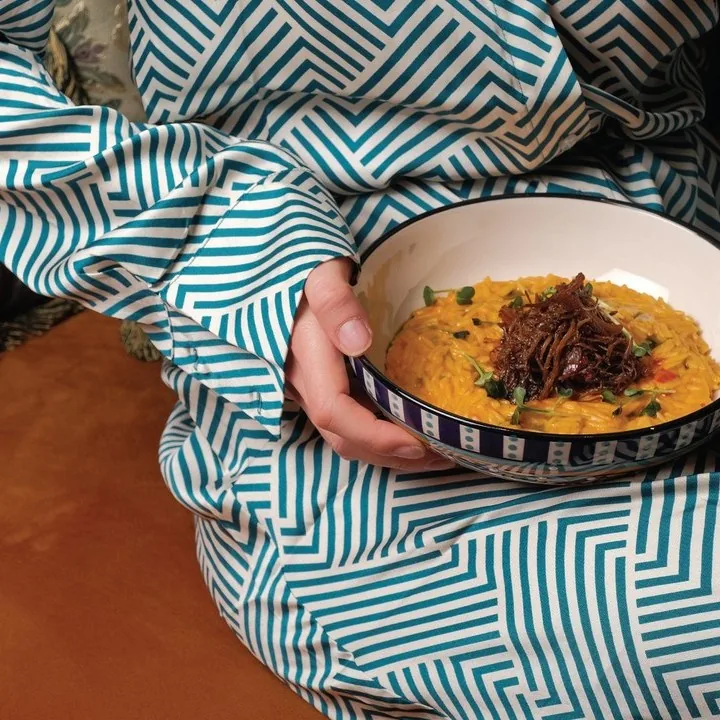 A bowl from the kitchen on a patterned cloth