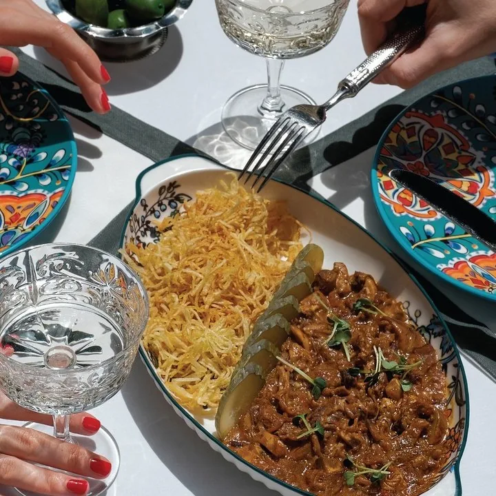 Plates from the kitchen on a laid table