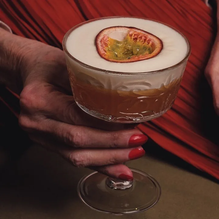 A passion fruit cocktail in a cut-glass coupe